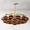 Modern Cabretti crystal globe chandelier illuminating a dining room table